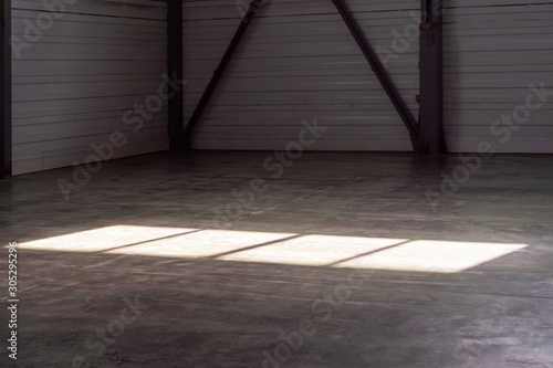 An empty warehouse is a large room.