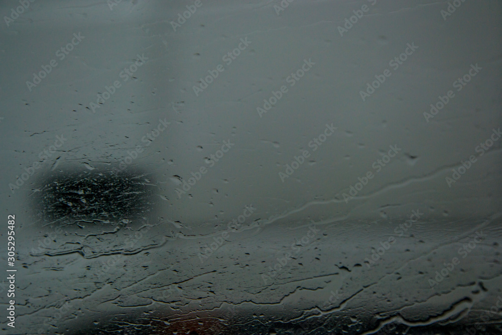 Water drops on the glass of a car, window texture, selective focus,  raindrops and blurred background Stock Photo | Adobe Stock