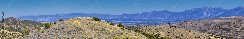 Views of Wasatch Front Rocky Mountains from the Oquirrh Mountains with fall leaves, Hiking in Yellow Fork trail and Rose Canyon in Great Salt Lake Valley. Utah, United States.