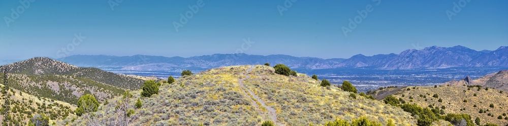 Views of Wasatch Front Rocky Mountains from the Oquirrh Mountains with fall leaves, Hiking in Yellow Fork trail and Rose Canyon in Great Salt Lake Valley. Utah, United States.