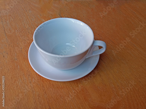 white coffee mug empty on the wooden table