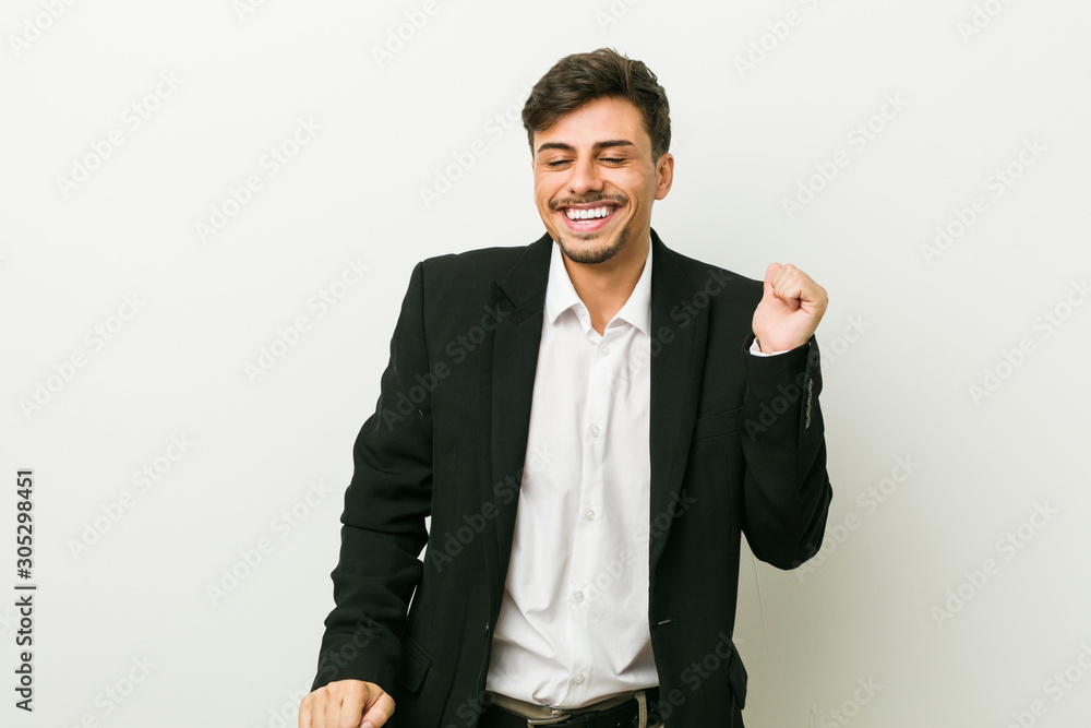 Young business hispanic man dancing and having fun. Young business hispanic man dancing and having fun.