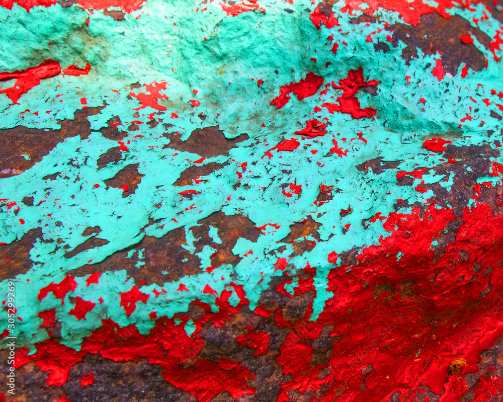 Old painted granite stone rock background. Blue, cyan, turquoise, aquamarine, red