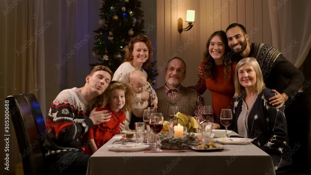 New Year. Family Concept. Family Is Photographed At The New Year's Table In The Apartment. New Year. Family Concept. Family Is Photographed At The New Year's Table In The Apartment.