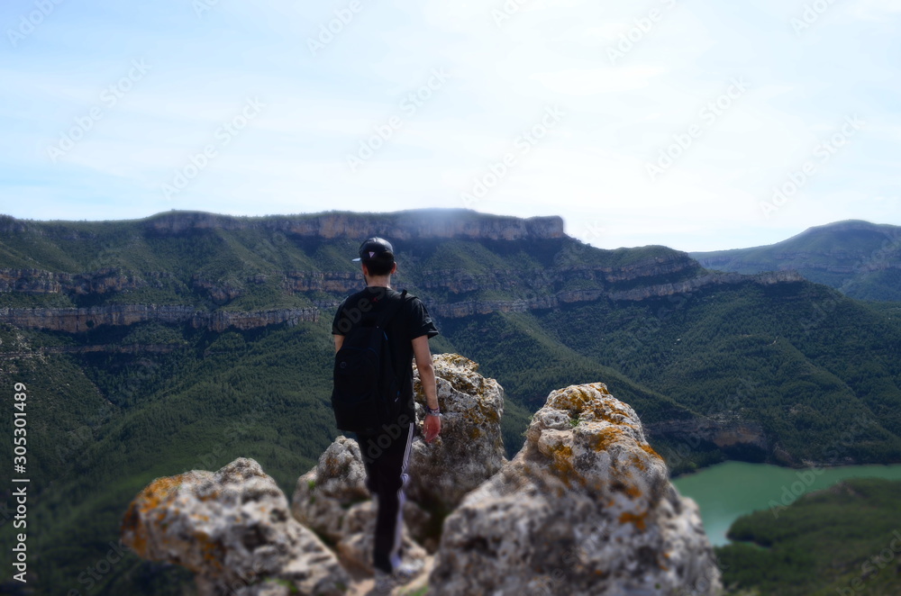 Boy Looking at the Mountain and Lake Landscape view