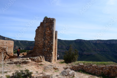 Girls Hiking in the Mountains with Old Castle