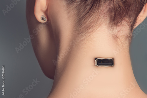 Usb charging port in woman's neck, cyborg woman concept. photo