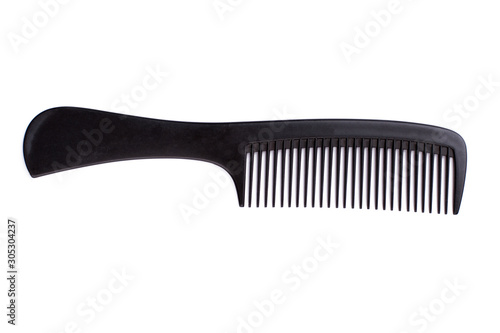 Black hair comb on white background. Plastic hair brush and copy space.