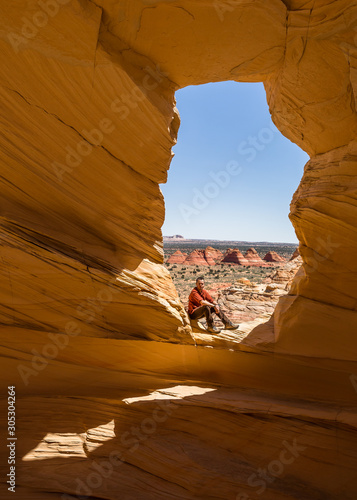 Slika na platnu Resting in the Alcove overlooking the teepee formations of sandstone cones of Northe Coyote Buttes in northern Arizona on the Kaibab Plateau