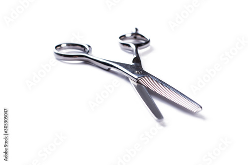 Hairdressing scissors isolated on white background. Metal barbers scissors. Space for text.