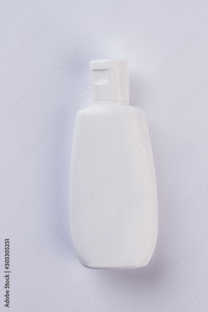 Plastic shampoo bottle on white background. White cosmetic bottle. Body care product. Plastic shampoo bottle on white background. White cosmetic bottle. Body care product.