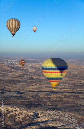  air balloons flight over landscape of Cappadocia, Turkey