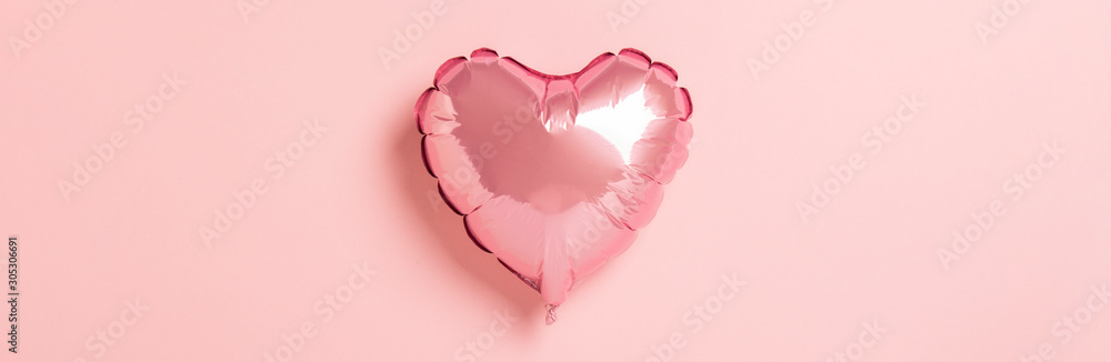 Pink air balloon heart shape on a pink background. Wedding concept, Valentine's Day, a gift for a loved one. Banner. Flat lay, top view - obrazy, fototapety, plakaty 