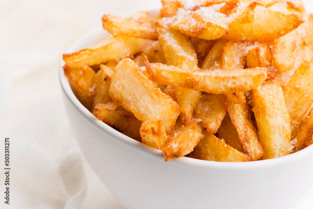 Bowl of potatoe fries on a white background Bowl of potatoe fries on a white background