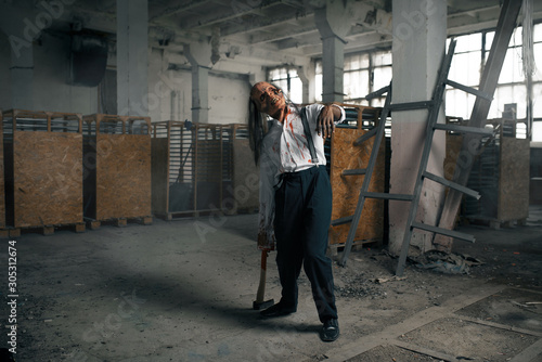Zombie man, undead human in abandoned factory