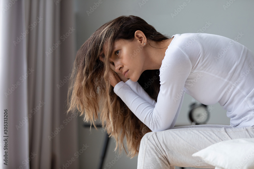 Woman awakened from night sleep feels negative emotions bad mood