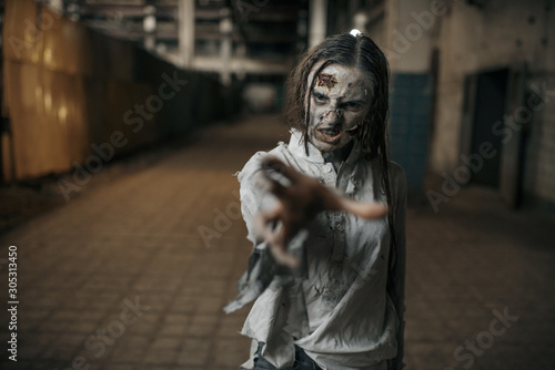 Female zombie searching fresh meat, horror