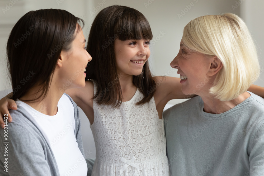Three generation relatives women spend time together at home Three generation relatives women spend time together at home