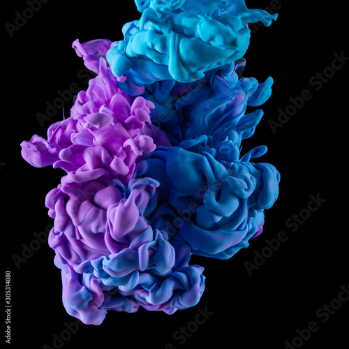 Full blue and purple ink in water against black