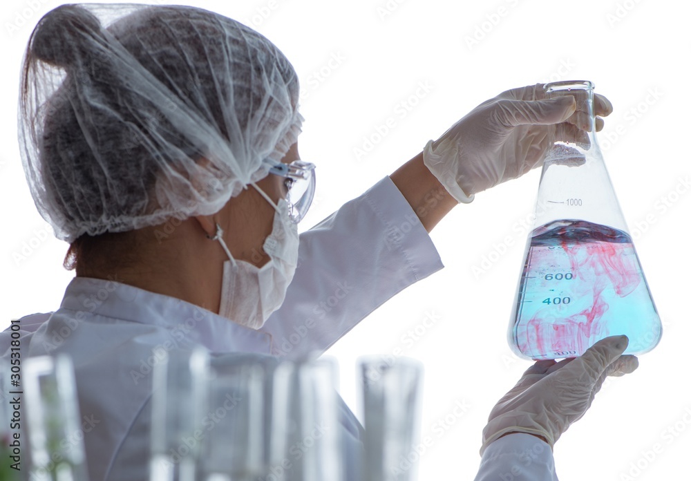 Fototapeta premium Female scientist researcher conducting an experiment in a labora