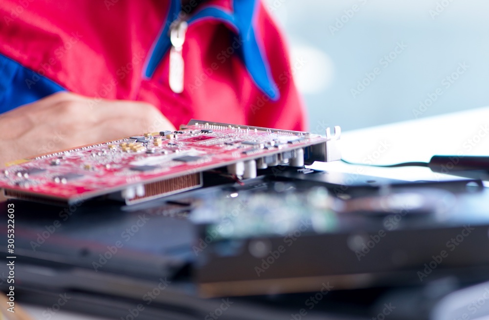 Repairman working in technical support fixing computer laptop tr Repairman working in technical support fixing computer laptop tr