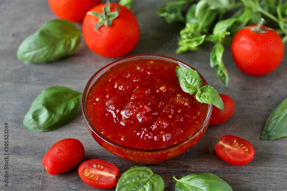 tomato jam. Jam from tomatoes with basil. Soft focus. Place for text. Copy Space. tomato jam. Jam from tomatoes with basil. Soft focus. Place for text. Copy Space.
