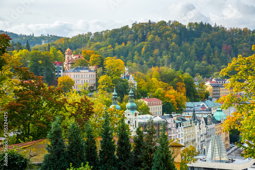 Cityscape of Karlovy Vary with thermal spring colonnade and church photo