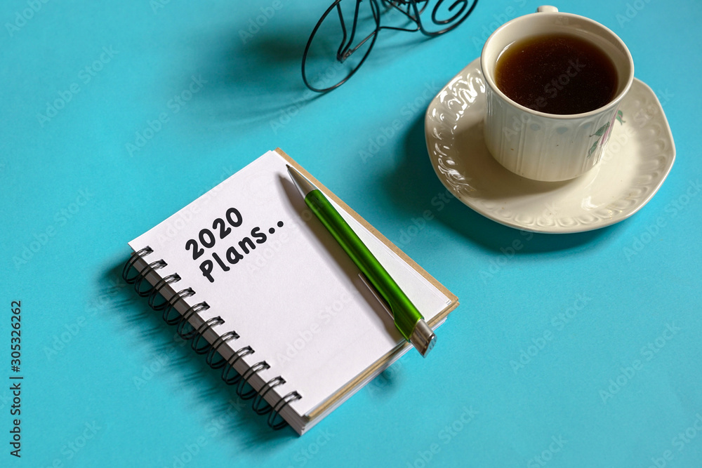 2020 new year goal, plan, action text on note pad. Top view or flat lay. 2020 new year goal, plan, action text on note pad. Top view or flat lay.