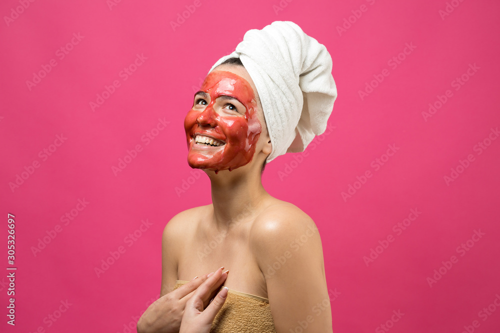 Beauty portrait of woman in white towel on head with gold nourishing mask on face. Skincare cleansing eco organic cosmetic spa relax concept. Beauty portrait of woman in white towel on head with gold nourishing mask on face. Skincare cleansing eco organic cosmetic spa relax concept.