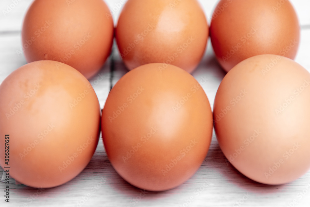 white egg on white wooden table. From above. Copy space white egg on white wooden table. From above. Copy space