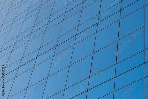 Blue glass windows of modern office building