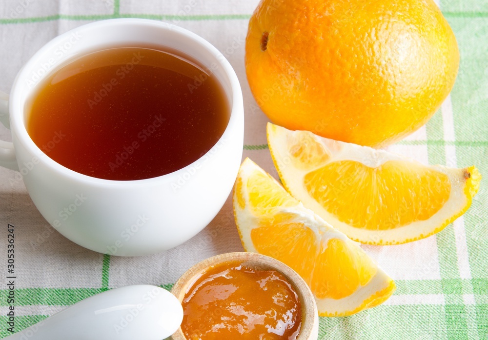 Cup of tea served with orange jam Cup of tea served with orange jam