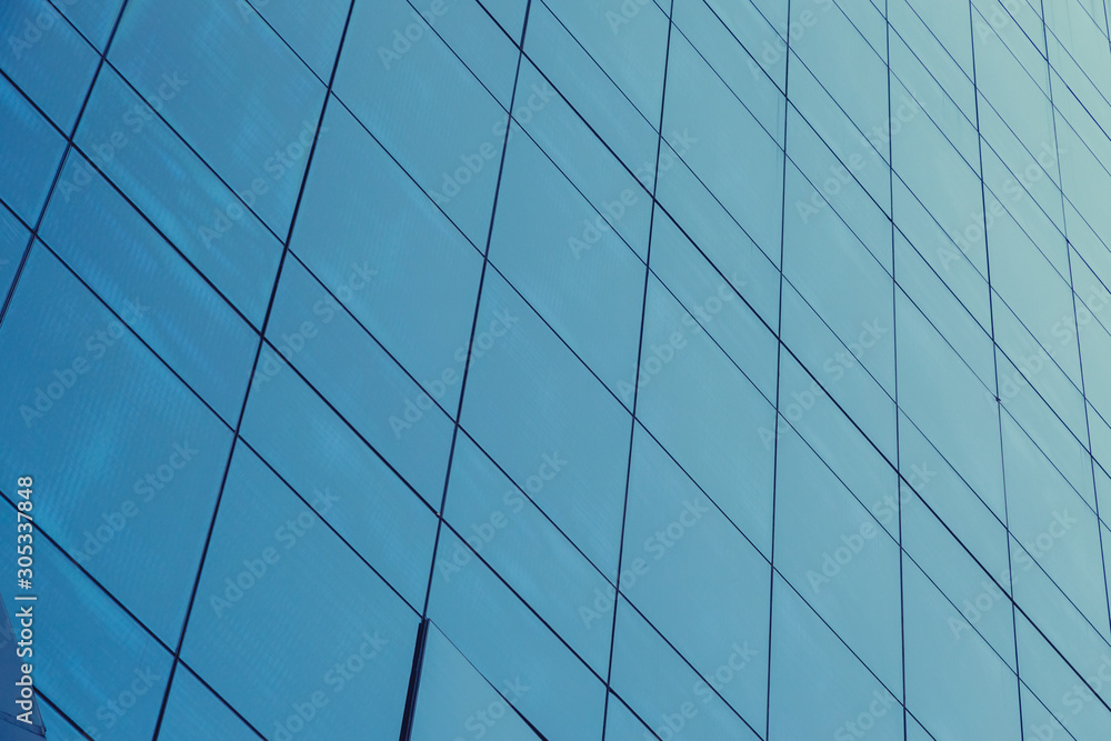 Blue glass windows of modern office building Blue glass windows of modern office building