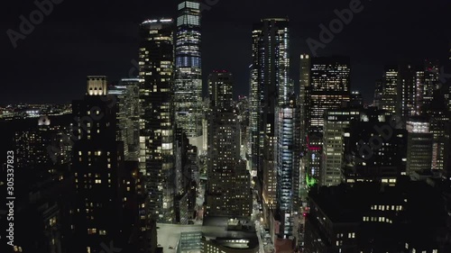 Aerial flying over manhattan night street.