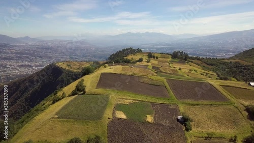 Open farmland on Pinchincha Ecuador mountain valley near city landscape photo