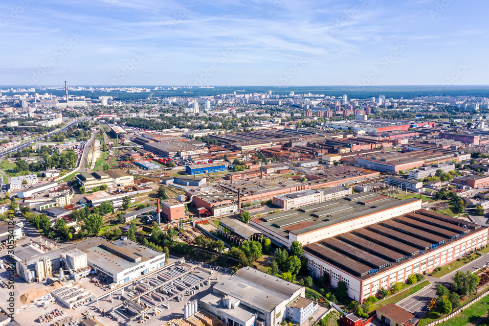 aerial panoramic photo of city industrial district with factories, warehouses and manufactures