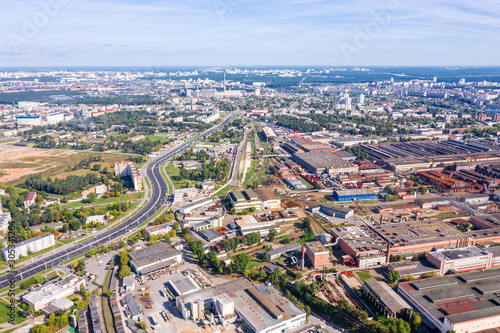 aerial panoramic view of city industrial area with lots of industrial buildings, plants and storehouses