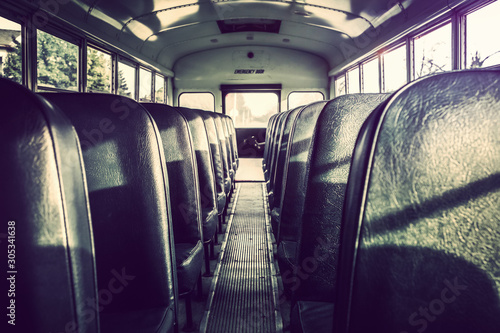 Dark shadowy empty interior of an old school bus