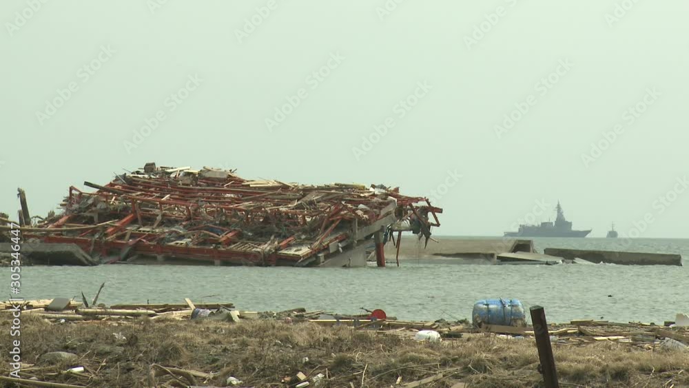 Japan Tsunami Aftermath - Flooded Building With Navy Ship In Background Japan Tsunami Aftermath - Flooded Building With Navy Ship In Background