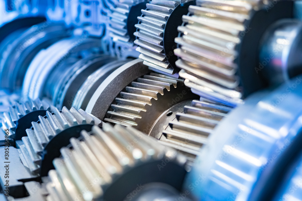 Industrial concept. The pattern of gears. Background with metal details. Concept of gears. Development of industrial equipment. Metal mechanism. Equipment for metal processing. Industrial concept. The pattern of gears. Background with metal details. Concept of gears. Development of industrial equipment. Metal mechanism. Equipment for metal processing.