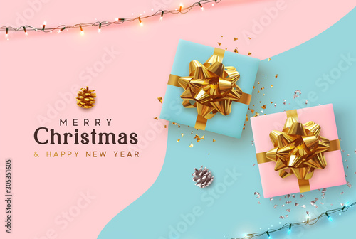 Merry Christmas and Happy New Year. Xmas background with realistic pink and blue gift boxes, festive bright light garland, Holiday banner, poster, greeting card. Advertising flyer brochure. soft color