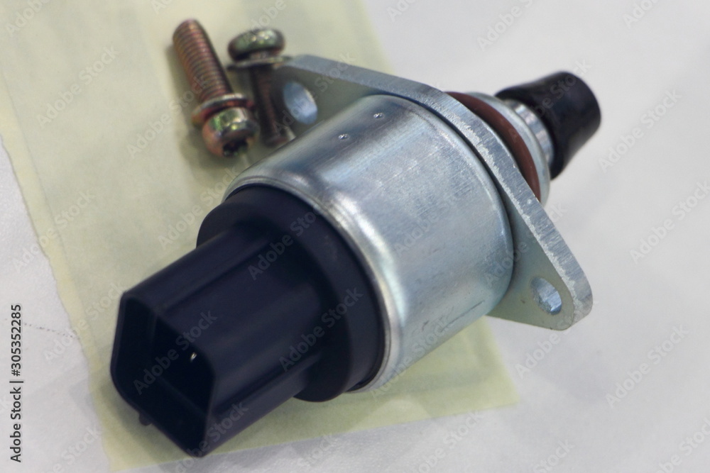 Car injector engine idler close up on white background Car injector engine idler close up on white background