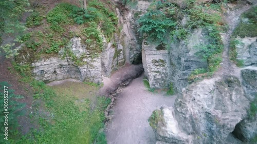 Devil's Oven or Large Ellite Natural Geological Monument  Located in the Gauja National Park at Lode Behind Cesis in Latvia. Licu – Langu Sandstone Cliffs Liepa Cave. Aerial Dron Shoot. photo