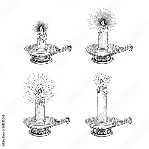 Hand drawn candle set. Burning candle in an old candlestick engraved in retro style. Vector illustration