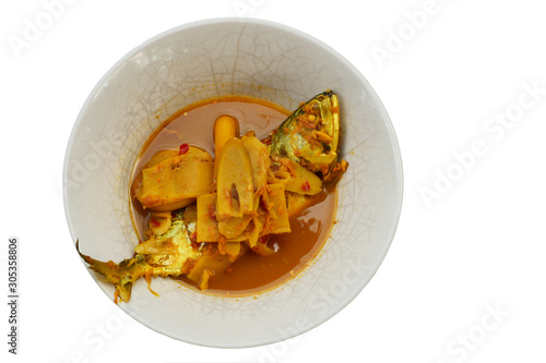 Sour soup curry with Short-bodied mackerel fish and bambusa vulgaris  or Bamboo shoots slice, Traditional spicy food culture of Thailand, Thai food in a bowl isolated on white background