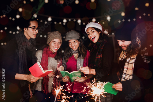 Posada Mexicana, Mexican friends Singing carols in Christmas in Mexico photo