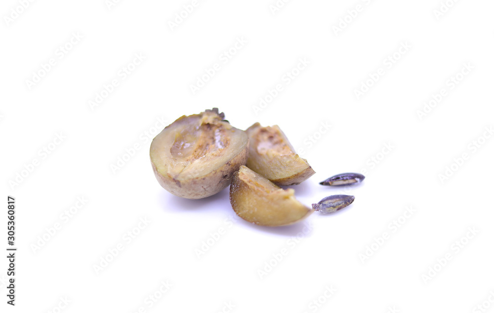 Sapota fruit cut into pieces and seeds in white background Sapota fruit cut into pieces and seeds in white background