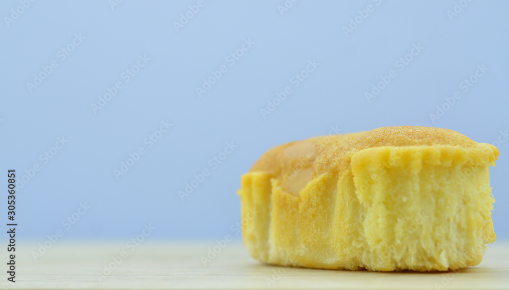 Delicious soft bread on a wooden background. Single Delicious soft bread on a wooden background. Single