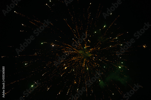 Firework on night background, bursting fireworks with stars and sparks. Festival firework