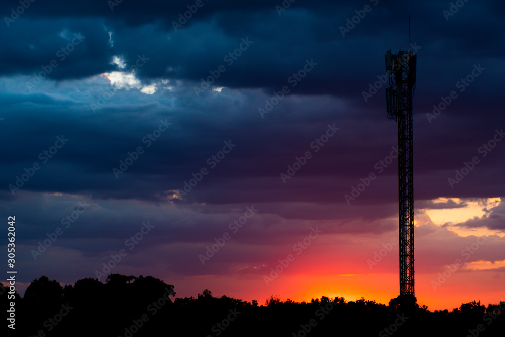 Silhouette images , multi-colored sky and telephone poles. Silhouette images , multi-colored sky and telephone poles.